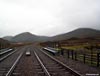 Looking south at A'Mharconaich, the Boar of Badenoch, and the Sow of Atholl from the railway crossing at Balsporran Cottages