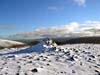 Beinn Bhreac summit. It looks peaceful but the white spots are wind-blown snow