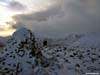 The sun disappears briefly as we leave the summit