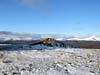 Summit cairn with the Cairngorms in the distance