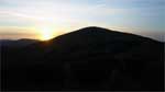 The sun sets behind Allermuir